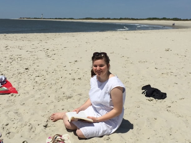 Mikela with a book on the sands of Cape May
