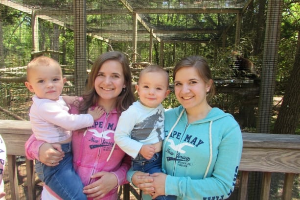 twins and twins pose in front of animals at the Cape May zoo