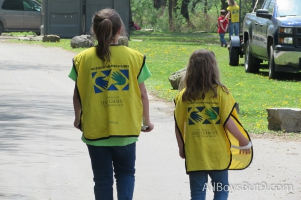 2 little girls head toward the "Mormon Helping Hands" project