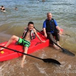 grandpa and grandson head out in the kayak - with grandpa fully- clothed!
