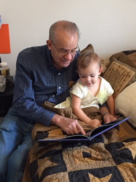 Grandpa reading to Adelynn