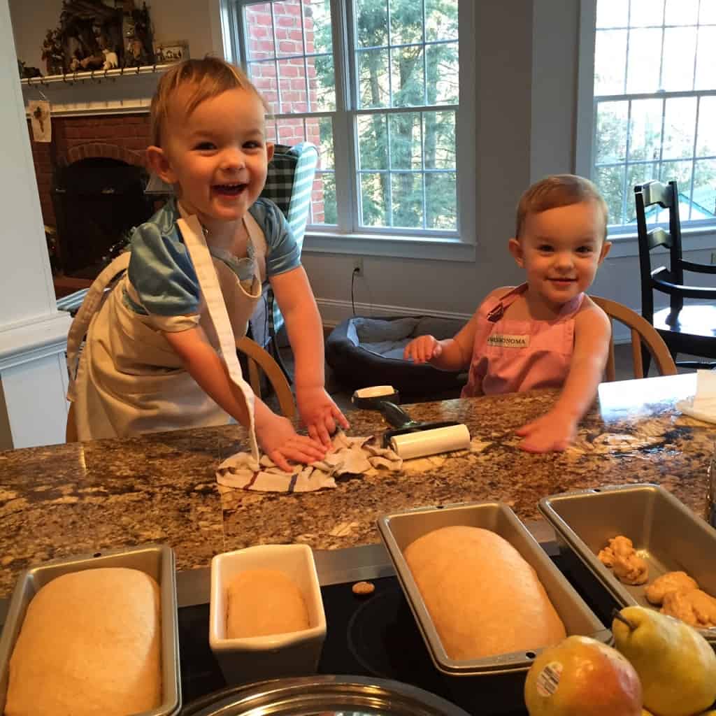 Addie and Sarah helping mom make bread!